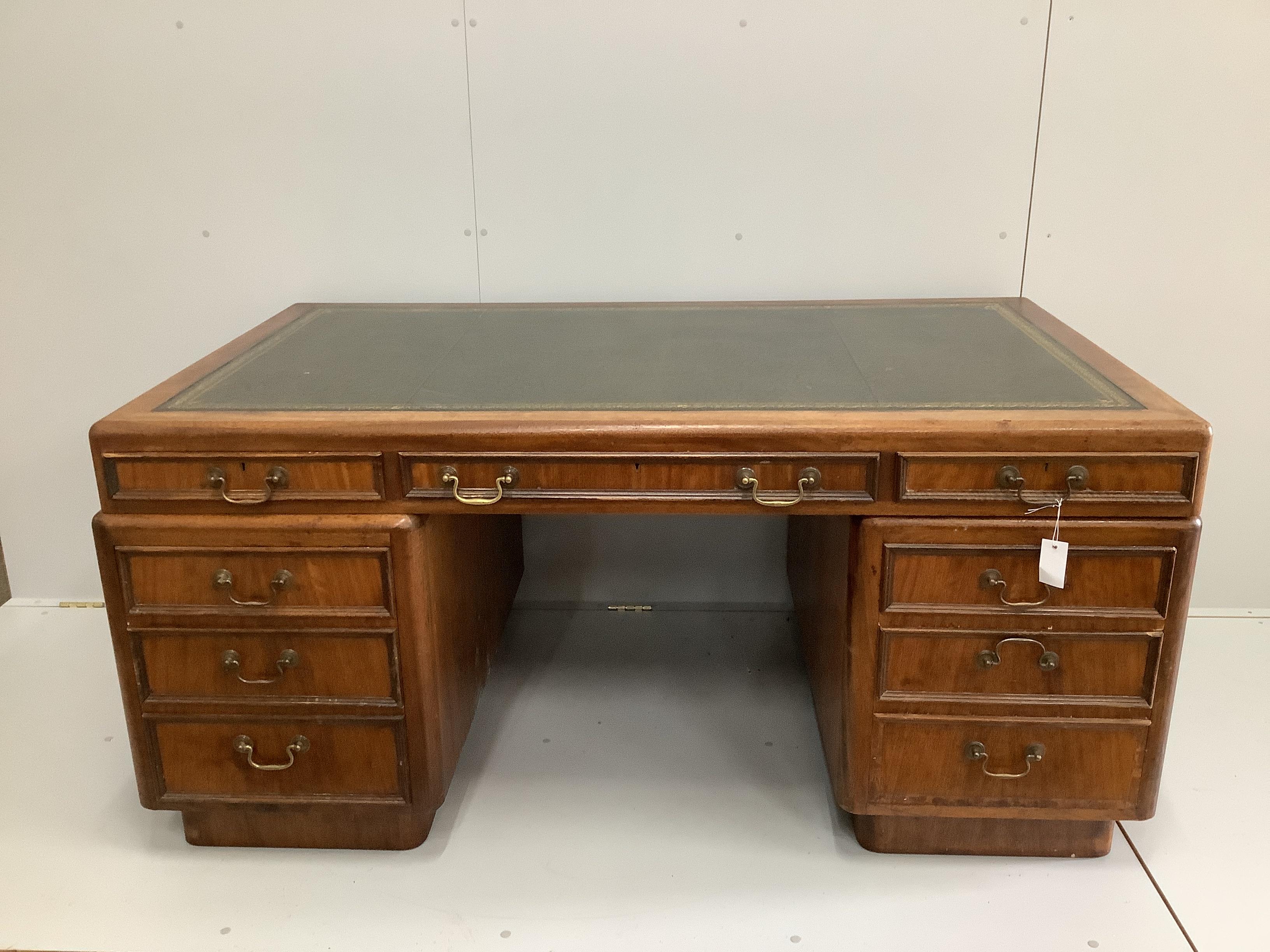 A mid century mahogany pedestal desk, width 162cm, depth 93cm, height 76cm